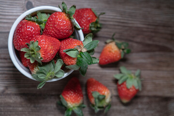 Red strawberries on the wooden table