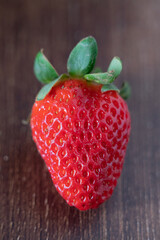 Red strawberries on the wooden table
