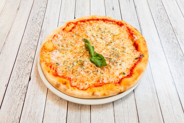 Delicious and light margarita pizza with mozzarella cheese and tomato, ideal dinner, snack or breakfast