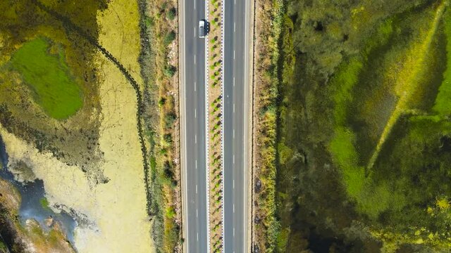 Aerial View of highway in India; national highway drone view; top view of railway line; 4 lane road in India; Moving Cars on highway ;