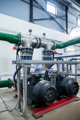 Obraz na płótnie Canvas Industrial interior of water pump, valves, pressure gauges