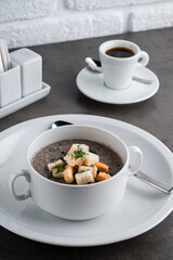 soup puree with mushrooms and croutons in an bowl