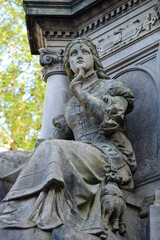 Fragment of a monument to a military man with a figure of a sitting woman