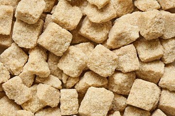 Lumpy brown sugar close-up, background, shallow depth of field