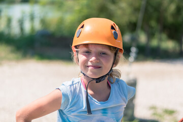 Fototapeta na wymiar child with orange protective helmet portrait