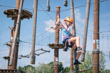 joy, adrenaline, fun and freedom in rope climbing centre in hot summer day