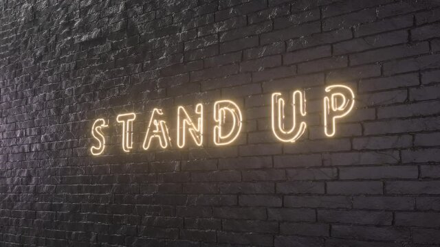 Glowing Stand Up emblem on black brick wall background