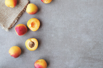Apricots on marble background viewed from above. Fresh and healthy fruit. Top view