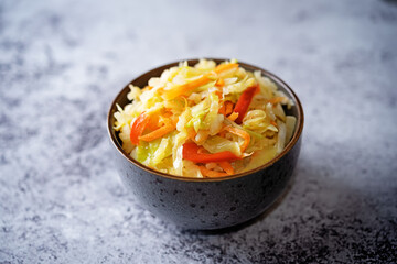 Cabbage carrot red pepper salad in a bowl