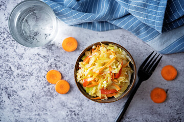 Cabbage carrot red pepper salad in a bowl