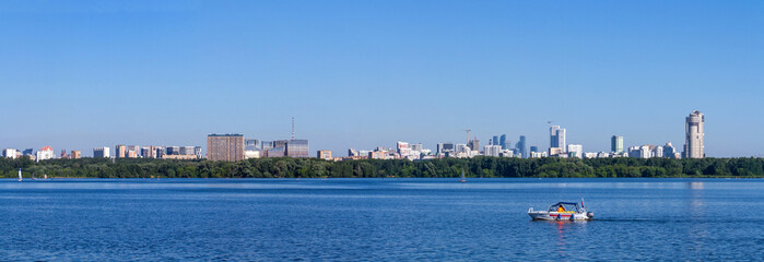 Fototapeta na wymiar Panoramic view of Strogino lake in Moscow city. Summer activities.