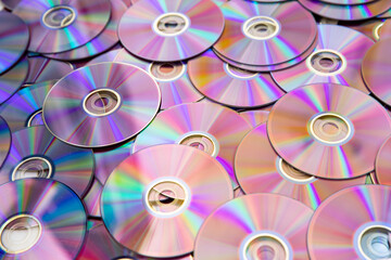 Discs for music and movie data are iridescent with mother-of-pearl.