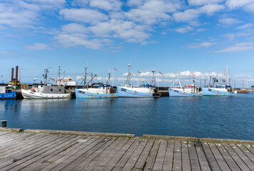 view of the harbor and marina in Gilleleje in northern Zealand in Denmark with many colroful fishing boats