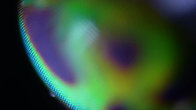 Macro sharp and detailed fly compound eye surface under microscope. 100x magnification.  The faceted structure of the eyes of flies and insects. The stunning beauty of the microcosm. Shallow depth 