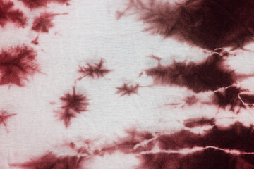 Red tie dye made on white fabric. Texture or Background © The Cuevax