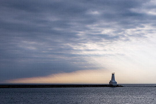 Storn clouds approaching a lighthouse