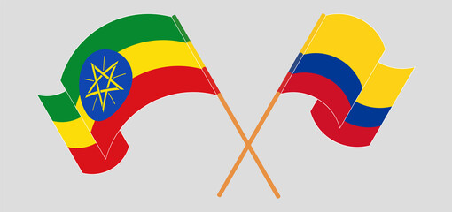 Crossed and waving flags of Ethiopia and Colombia