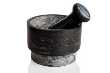 Mortar with a pestle for grinding and crushing spices, peppers and herbs, heavy stone, isolated on a white background - obrazy, fototapety, plakaty