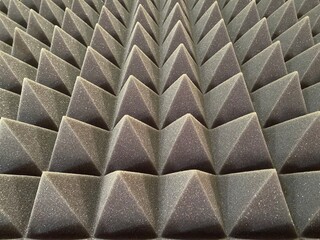 Soundproof acoustic foam for the recording studio and any room. The texture of the volumetric pyramids of the three-dimensional volume of triangles.