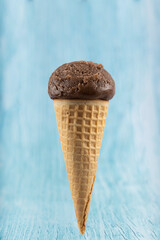 Tasty chocolate flavored ice cream cone.