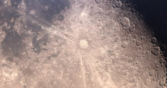 Moon zoom out from crater 4K. High resolution and super detailed lunar. Shadows and lights moving from light to dark in space. Stars at the background. Elements of this image furnished by NASA.