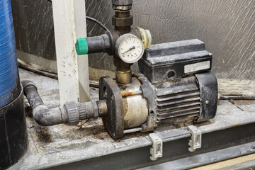 Old water pump with manometer.