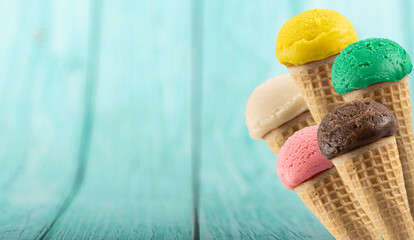 Tasty ice cream cones with different flavors.