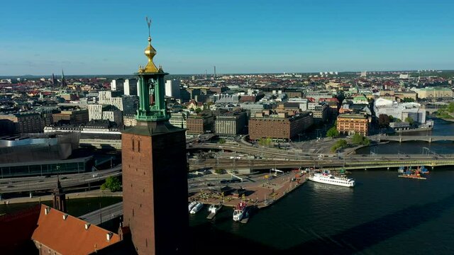 Establishing aerial fottage of Stockholm City and town hall during a summer day with blue skies