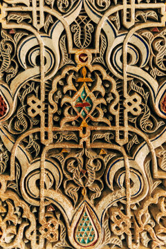 Golden signs on wall in ancient temple