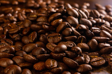 Natural background for Cafe menu or brochure template - macro photo of brown roasted coffee beans, close up