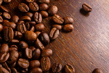 Natural background for Cafe menu or brochure template - macro photo of brown roasted coffee beans, close up