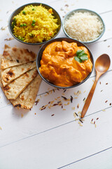 Fresh and tasty Butter Chicken served in ceramic bowl. Indian traditional dish