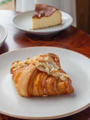 Almond Croissant on a white ceramic plate.