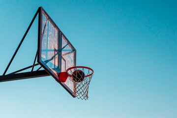 A basketball basket with a ball
