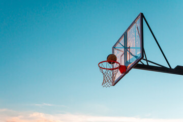 A basketball basket with a ball