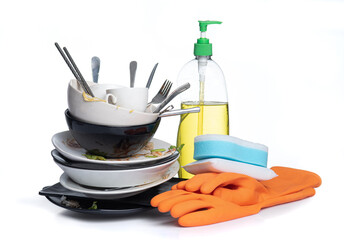 Dirty dishes pile needing washing isolated on white background