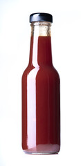 Glass bottle of ketchup on white background