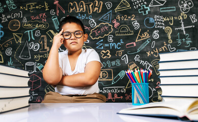 Fototapeta premium Child sitting and acting in the classroom