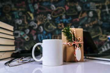 the cup and giftbox on the table in the classroom.