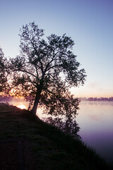 Fototapeta na wymiar Colorful sunrise over a Lake 