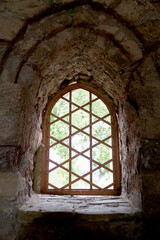 Fototapeta na wymiar a window in a castle with stone walls