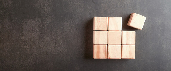 Wooden cubes on black background.