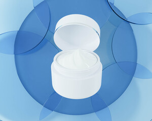 A white cream jar placed on a blue background