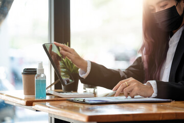 new normal business practise of business people work in office wearing face mask to protect coronavirus covid-19 infection. business new normal to protect coronavirus covid-19 to work in office