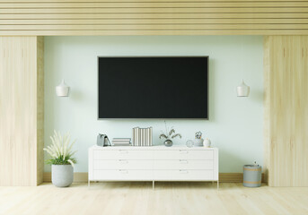 The living room is decorated with furniture, small plant pots, table and TV.