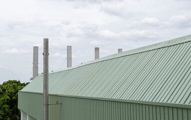 Fototapeta premium Industrial roofs top and chimneys