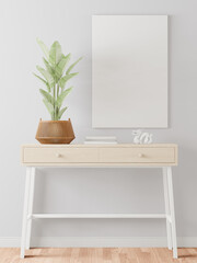 The living room is decorated with a storage table, picture frames and small plant pots.