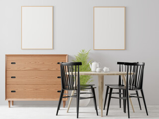 The dining table set in the room has a picture frame attached to the wall.