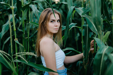 Young russian woman in a field of tall grass