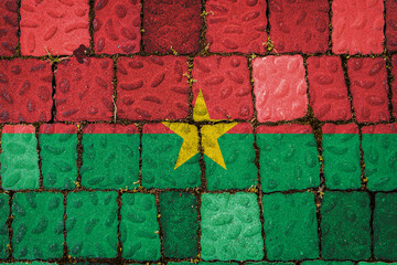 National flag of Burkino Faso on stone  wall background. Flag  banner on  stone texture background. - Powered by Adobe